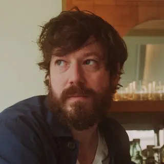 J.