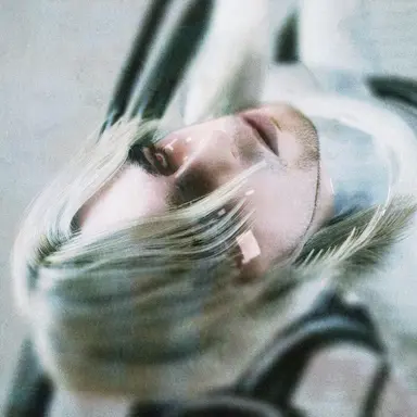 T.